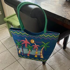 beach bag with small zipper pocket on inside, and a zipper closure on the inside